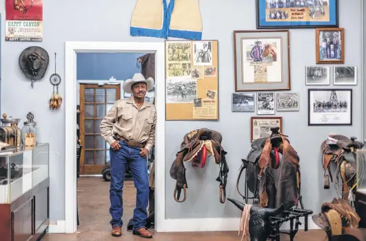  ?? Photos by Michael Starghill Jr. / New York Times ?? Larry Callies stands inside the Black Cowboy Museum in Rosenberg. The cowboy used his life savings to open it in 2017.
