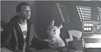  ?? WARNER BROS. ?? Tim (Justice Smith) teams with cute sleuth Pikachu (voiced by Ryan Reynolds) to find his missing dad in the comedy “Pokemon: Detective Pikachu.” The film topped “Avengers: Endgame” in the Valley box office this week.