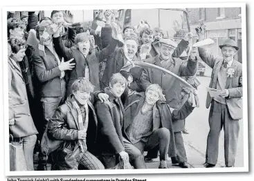  ??  ?? John Tennick (right) with Sunderland supporters in Dundas Street.