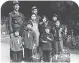  ??  ?? A Japanese American family waits to be interned (confined in a camp).