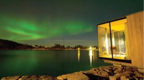  ??  ?? Spectacula­r sky views from the cabins at Manshausen Island Resort include a panoramic view of Norway’s northern lights.