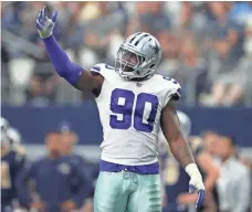  ?? MATTHEW EMMONS, USA TODAY SPORTS ?? DeMarcus Lawrence tries to get Cowboys fans pumped up.