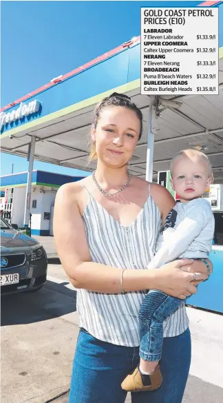  ?? Picture: JASON O'BRIEN ?? Brooke Leech with son Lleyton ahead of today’s special offer of E10 fuel for 99c/litre at Freedom St Clair’s in Southport.