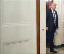  ?? PABLO MARTINEZ MONSIVAIS - THE ASSOCIATED PRESS ?? President Donald Trump walks into the State Dinning Room of the White House in Washington to meet with U.S. mayors and governors for an Infrastruc­ture Summit, Thursday.