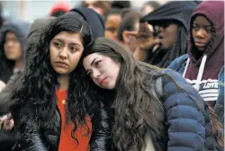  ?? Paul Chinn / The Chronicle ?? El Cerrito High School seniors Danna Rios (left) and Vivian Bocanegra attend a rally in the quad after the student walkout.