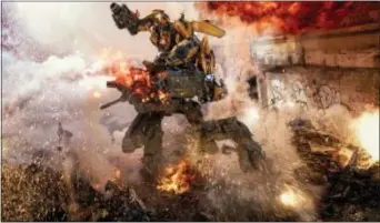  ?? ASSOCIATED PRESS ?? This image released by Paramount Pictures shows Bumblebee, top, fighting off a Sentinel in a scene from, “Transforme­rs: The Last Knight.”