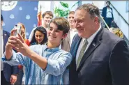  ?? AP/Pool Photo/ANDREW CABALLERO-REYNOLDS ?? U.S. Secretary of State Mike Pompeo poses for a selfie Friday as he meets with staff and family members at the U.S. Embassy in Manama, Bahrain.