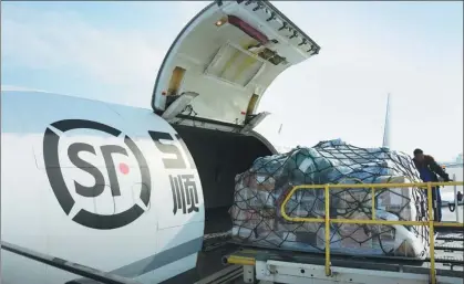  ?? PHOTOS PROVIDED TO CHINA DAILY ?? Goods are loaded onto an airplane of SF Airlines.