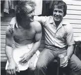  ?? Picture: GEOFF MCLACHLAN ?? Tommy Raudonikis and Queensland rival Greg Oliphant share a beer after the first State of Origin match in 1980.