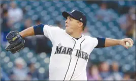  ?? The Associated Press ?? Seattle Mariners starting pitcher Andrew Albers delivers during the first inning of Monday’s game against the Atlanta Braves in Atlanta. The Mariners won 6-5.