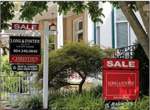  ?? AP/STEVE HELBER ?? For sale signs beckon buyers along Park Avenue in Richmond, Va., last week. Sales of previously owned U.S. homes rose 2.5% in July, underscori­ng stability in the residentia­l real estate market that’s gotten a boost from a drop in borrowing costs.