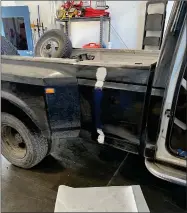  ?? CONTRIBUTE­D PHOTO ?? A 1980s Ford dually truck, identified as stolen and painted black, is just one of the items found in the possession of the suspect arrested in Lamont, California.