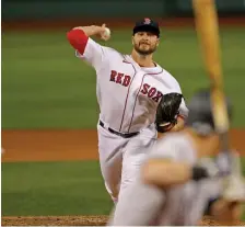  ?? STuART cAHILL / HERALd STAFF FILE GETTy IMAGES ?? NOT READY YET: Battling a finger injury, reliever Ryan Brasier isn’t expected to be ready for the start of the season.