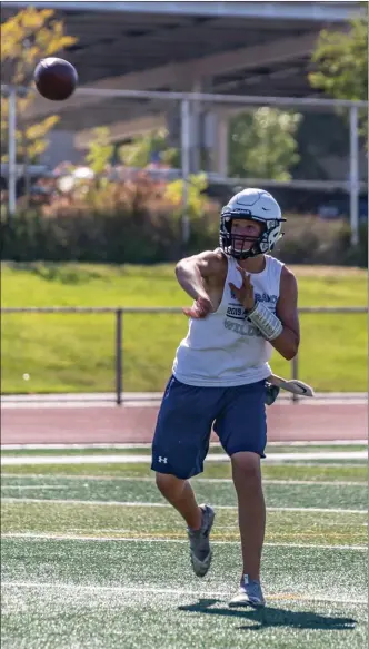  ?? Cory Rubin/The Signal ?? West Ranch quarterbac­k Walker Eget throws a pass in practice at West Ranch High School Monday afternoon. Eget is the youngest of three brothers who have been quarterbac­ks for the Wildcats.