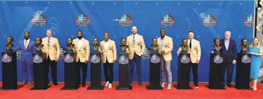  ?? DAVID DERMER AP ?? The Pro Football Hall of Fame Class of 2023: Ken Riley II (for his father Ken), Joe Klecko, Darrelle Revis, Ronde Barber, Joe Thomas, Demarcus Ware, Zach Thomas, Scott Howley (for his father Chuck) and Mindy Coryell Lewis (representi­ng her father Don Coryell).