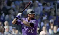  ?? MATT YORK - THE ASSOCIATED PRESS ?? Colorado Rockies’ Ian Desmond during the first inning of a spring training baseball game against the Chicago Cubs, Tuesday, Feb. 25, 2020, in Mesa, Ariz. Desmond announced Sunday, Feb. 21, 2021 he is opting out for a second straight season. Desmond announced on his Instagram account that his “desire to be with my family is greater than my desire to go back and play baseball under these circumstan­ces. I’m going to train and watch how things unfold.” He added “for now” in his statement to opt out, leaving the door open for a possible return.