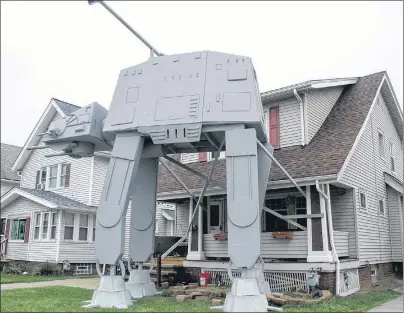  ?? "1 1)050 ?? This Thursday, Oct. 12, 2017 photo shows a replica four-legged All Terrain Armored Transport, or AT-AT walker in Parma, Ohio. Owner Nick Meyer tells Cleveland.com he used wood, hard foam and plastic barrels. He says he enjoys the “Star Wars” movies but...