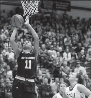  ??  ?? Notre Dame forward Brianna Turner (11) shoots as South Dakota State guard Gabrielle Boever (4) and Macy Miller look on during the second half Saturda in Brookings, S.D. Turner had 20 points as the No. 3 Fighting Irish held off South Dakota State 75-64.