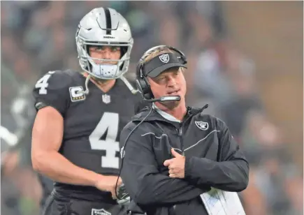  ??  ?? Raiders coach Jon Gruden says fifth-year quarterbac­k Derek Carr is part of his plans for the team.