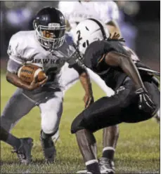  ?? TRENTONIAN FILE PHOTO ?? Council Rock South’s Elias Mayo carries the ball as Pennsbury’s Nasan Robbins defends during action from last season.