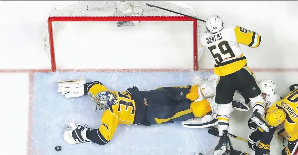  ?? PHOTOS: BRUCE BENNETT/GETTY IMAGES ?? Nashville Predators goaltender Pekka Rinne makes a save against the Pittsburgh Penguins during the second period on Monday in Nashville.