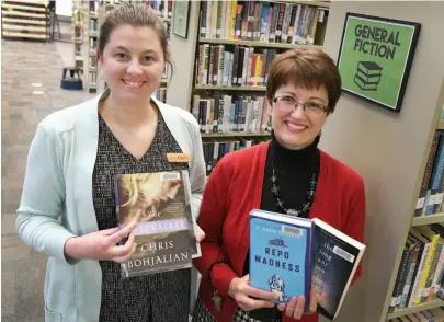  ?? CITIZEN PHOTO BY BRENT BRAATEN ?? Amy Dhanjal, communicat­ions coordinato­r, and Patricia Gibson, adult services librarian, show a selection of the Prince George Public Library’s most borrowed books of 2017.