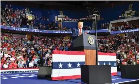  ?? Photograph: Nicholas Kamm/AFP/Getty Images ?? The upper section is seen partially empty as Donald Trump speaks at the BOK Center in Tulsa.