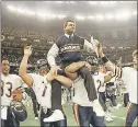  ?? AP FILE PHOTO ?? Coach Mike Ditka is carried off the field after the Bears defeated the Patriots in Super Bowl XX in New Orleans in 1986.