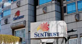  ?? PHOTOS BY CURTIS COMPTON / CCOMPTON@AJC.COM ?? Atlanta-based SunTrust Bank and its Southeaste­rn rival BB&amp;T are merging to create the sixth-largest bank in the U.S. The marriage will cost Atlanta a Fortune 500 headquarte­rs.