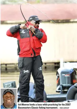  ?? | ROB CARR/ AP ?? Ish Monroe hooks a basswhile practicing for the 2007 Bassmaster­s Classic fishing tournament.