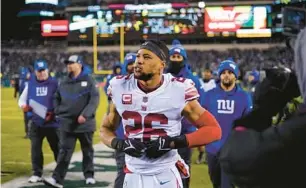  ?? MATT ROURKE/AP ?? New York Giants Saquon Barkley takes in the action during an NFL divisional round playoff football game on Jan. 21 in Philadelph­ia.