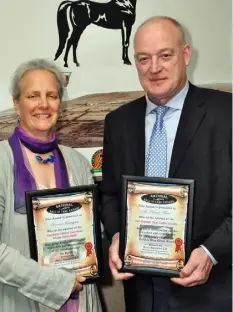  ??  ?? Suzanna Crampton of Bennettsbr­idge, recipient of an award for the Zwartbles Sheep Associatio­n, and ICSA president Patrick Kent of Newross, who received an award for his contributi­on to the Irish Belgian Blue Cattle Breeding Society