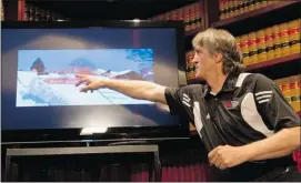  ?? Tyler Anderson, Postmedia News ?? Predrag (Bebe) Zoricic points to a video image of his son’s final jump. Nik Zoricic died after falling at the finish line during a World Cup Ski race in Grindelwal­d, Switzerlan­d.