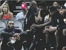  ?? AP PHOTO/MATT YORK ?? Phoenix Suns players watch from the bench during the second half of Game 7 of an NBA basketball Western Conference playoff semifinal against the Dallas Mavericks, on Sunday, in Phoenix.