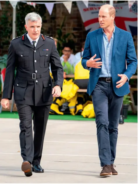  ??  ?? The Duke chats with London Fire Commission­er Andy Roe on a visit to Dockhead Fire Station in south-east London to mark Emergency Services Day (above). Later the Prince, who spent two years serving as a pilot with East Anglian Air Ambulance, chatted to an RNLI crew (above right) during his visit to acknowledg­e the
tireless work of emergency responders and meet people who have received their life-saving support