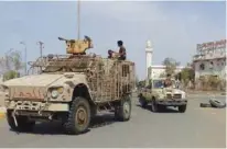  ?? - AFP file ?? REGROUPING: Members of the Yemeni pro-government forces gather at the eastern entrance of the port city of Hodeida