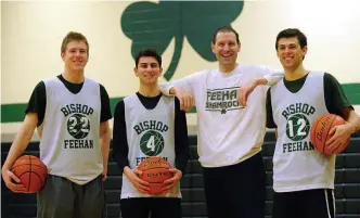  ?? BOSTON HERALD FILE ?? NEW OPPORTUNIT­Y: Matt Freeman (second from right), formerly the Bishop Feehan boys basketball coach, has been named the girls basketball coach at Braintree.