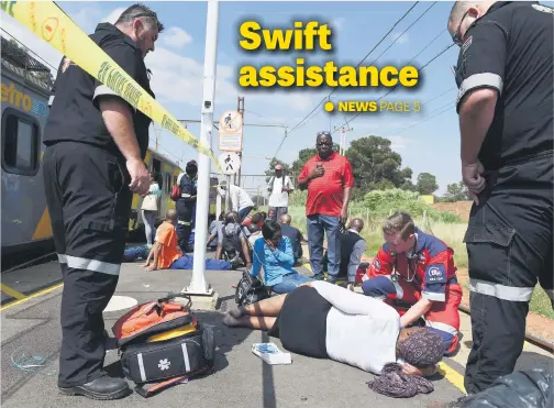  ?? Picture: Neil McCartney ?? Injured passengers on the platform as they are attended to by paramedics after two trains collided at about 7.15am at Geldenhuys Station in Germiston yesterday. Two-hundred and twenty-six people were injured.