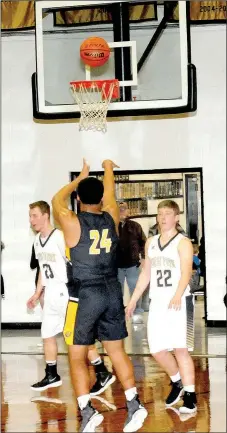  ?? MARK HUMPHREY ENTERPRISE-LEADER ?? Prairie Grove senior Demarkus Cooper is right on the money with this 3-point shot when West Fork defenders left him unguarded on the perimeter. The Prairie Grove boys ran away from West Fork, 78-56, Tuesday, Jan. 16.