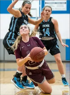  ?? Steph Chambers/Post-Gazette ?? Beaver’s Anna Blum falls while driving to the basket Tuesday night against Penn Cambria in a 48-36 Class 3A PIAA second-round victory.