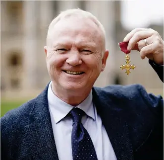  ?? ?? Former defender Alex McLeish with his OBE at Windsor Castle earlier this month