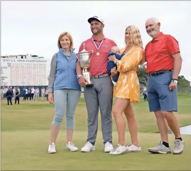  ?? GOLF|RANKINGS
Orlando Ramirez-usa TODAY Sports ?? Jon Rahm and his family celebrate with the trophy after winning he U.S. Open golf tournament at Torrey Pines Golf Course on Sunrday.