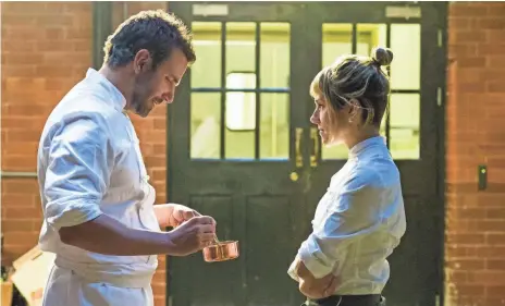  ?? ALEX BAILEY, THE WEINSTEIN COMPANY ?? Quick-tempered chef Adam (Bradley Cooper) and colleague Helene (Sienna Miller) stir up more than sauce in the comedy-drama.