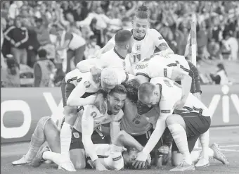  ??  ?? England players celebrate after reaching their first European Championsh­ip final.