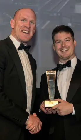  ??  ?? James Duff from ARUP is presented with the Emerging Talent Award from Paul O’Connell at the Irish Independen­t Property Excellence Awards 2016