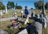  ?? PHOTO BY SANDI YANISKO/THE HILL SCHOOL ?? Gary Arthurs, a resident of Pottstown, offers his mowing expertise during the Edgewood Cemetery cleanup day.