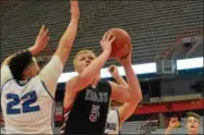  ?? JOHN BREWER - ONEIDA DAILY DISPATCH ?? Chittenang­o’s Sam Hill attempts a shot in the paint against Westhill’s Zechariah Brown during Sunday’s Section III Class B final.