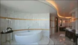  ?? KAMRAN JEBREILI — THE ASSOCIATED PRESS FILE ?? FILE- This file photo shows the master bathroom in the Abu Dhabi Suite at the St. Regis in Abu Dhabi, United Arab Emirates. The informatio­n of as many as 500 million guests at Starwood hotels has been compromise­d and Marriott said that it’s discovered that unauthoriz­ed access to data within its Starwood network has been taking place since 2014. The company said Friday that credit card numbers and expiration dates of some guests may have been taken.
