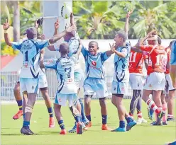  ?? Picture : JONACANI LALAKOBAU Picture : JONACANI LALAKOBAU ?? The victorious Nasinu Secondary School Panthers team celebrate after their win against Ba Provincial Free Bird
Institute Dragons.
Left: Former Flying Fijian winger, Mosese Luveitasau with his namesake son yesterday.