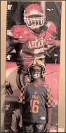  ?? Courtesy of Hayden family ?? Chase Hayden, then 7, stands in front of a poster of Darren McFadden in 2006 at his home in Tennessee. Hayden’s father Aaron bought his son the poster of McFadden, who played running back for the Razorbacks in 2005- 2007.